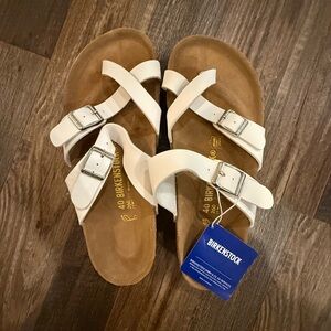 Birkenstock Cream Sandals with Silver Buckles